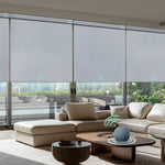 Motorized blackout roller shades with geryish white fabric, ideal for Bedrooms, Living Rooms